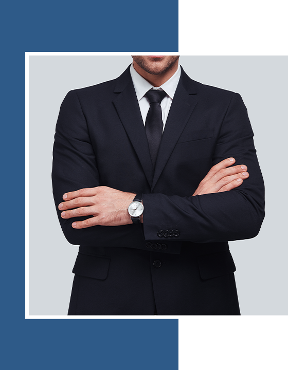 home-0101 young man in full suit keeping arms crossed and looking at camera
