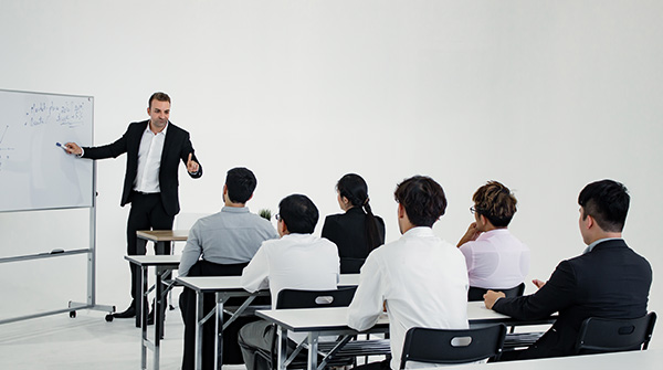 services-policy-and-accreditation-support Meeting and planning of working as a team together of Asian people and foreigners.